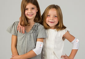 two girls wearing Wrap-E-Soothe Sleeves